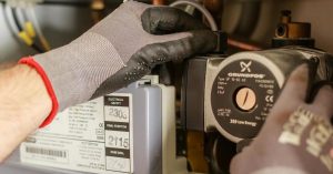 A Gas Engineer Servicing a Boiler in Colchester, Essex