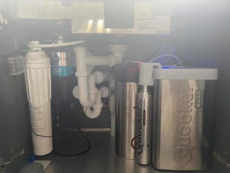 Quooker boiling water tank and filter plumbed in under a kitchen sink